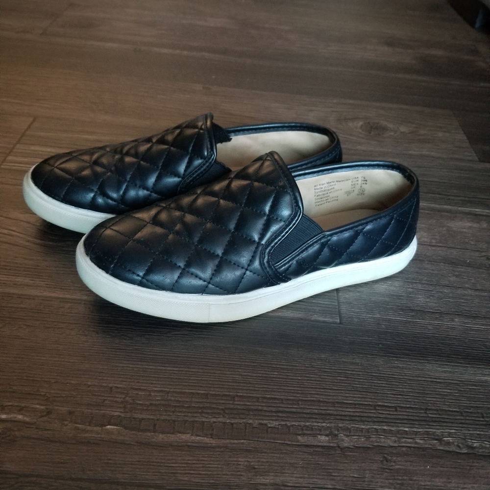 Black quilted slip on shoes